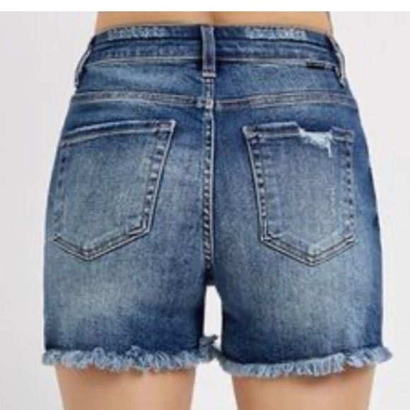 Risen high rise. Distressed jean shorts. - Picture 3 of 9